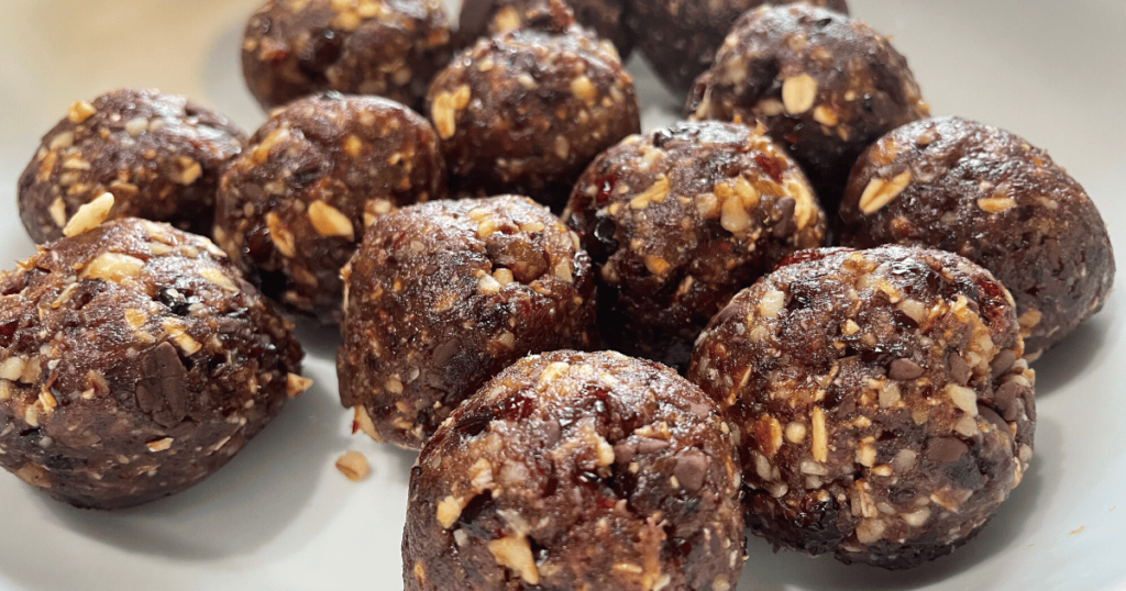 Delicious and healthy chocolate cranberry walnut energy balls on a plate